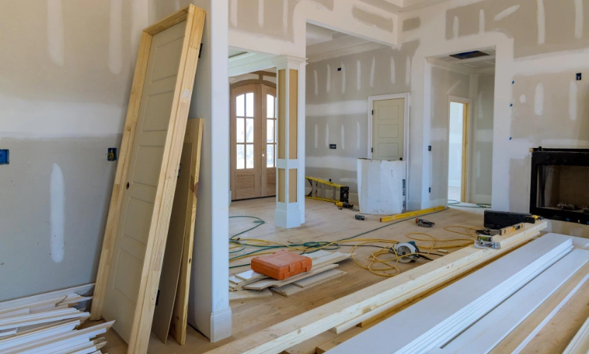 Interior home remodeling in Los Angeles with drywall installation and construction materials on site
