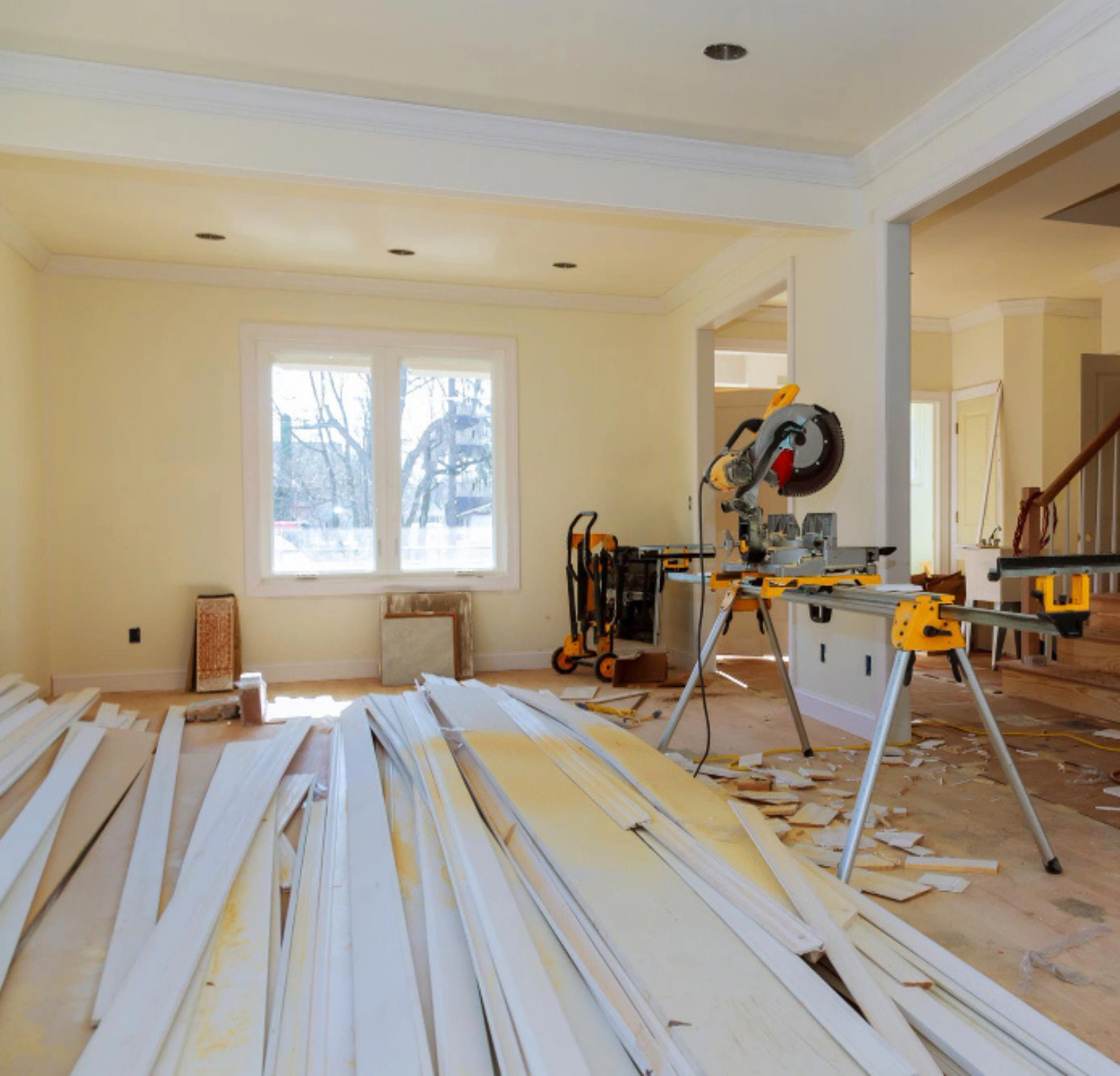 Living room renovation in Los Angeles with flooring work and construction tools in progress